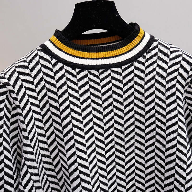 Women's knitted sweaters featuring a modern herringbone pattern in black and white with a vibrant yellow collar.